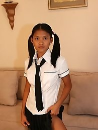 Cute Kat Young strips wearing a School Girl Uniform